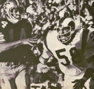Saints quarterback gets the pass off under pressure from Ram linebacker Isiah Robertson